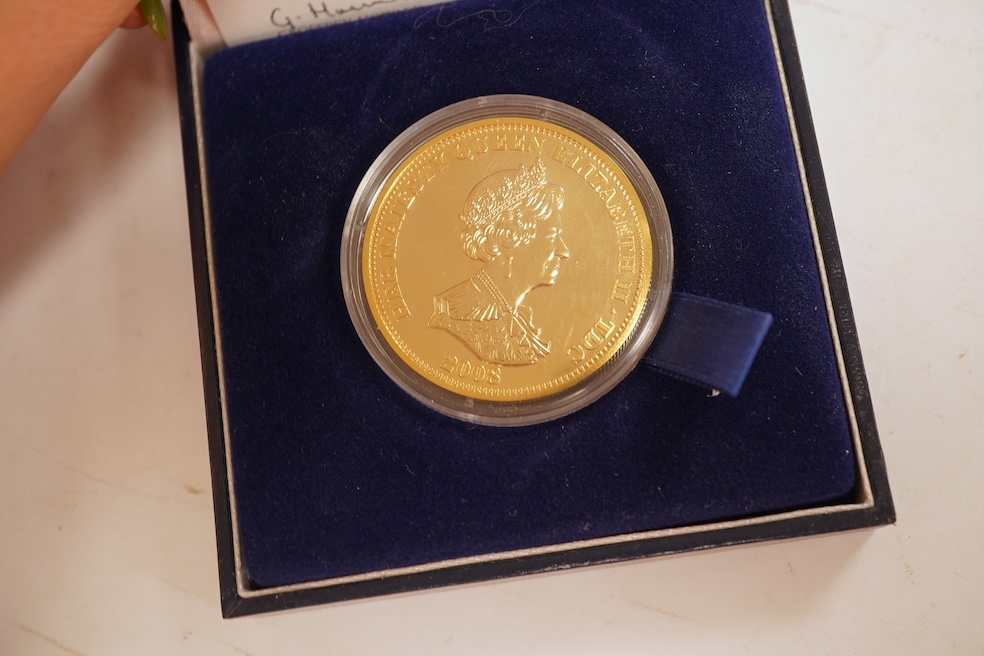 A collection of cased silver and cupro nickel proof and uncirculated sets and coins, including four Royal Mint UK proof coin year sets for 2002-2005, Royal Mint UK silver proof £2, London mint office silver commemorative